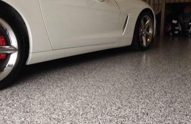 Car parked on a flake epoxy garage floor