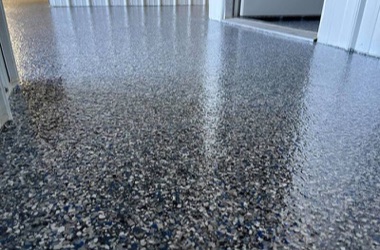 Close-up of a glossy flake epoxy floor